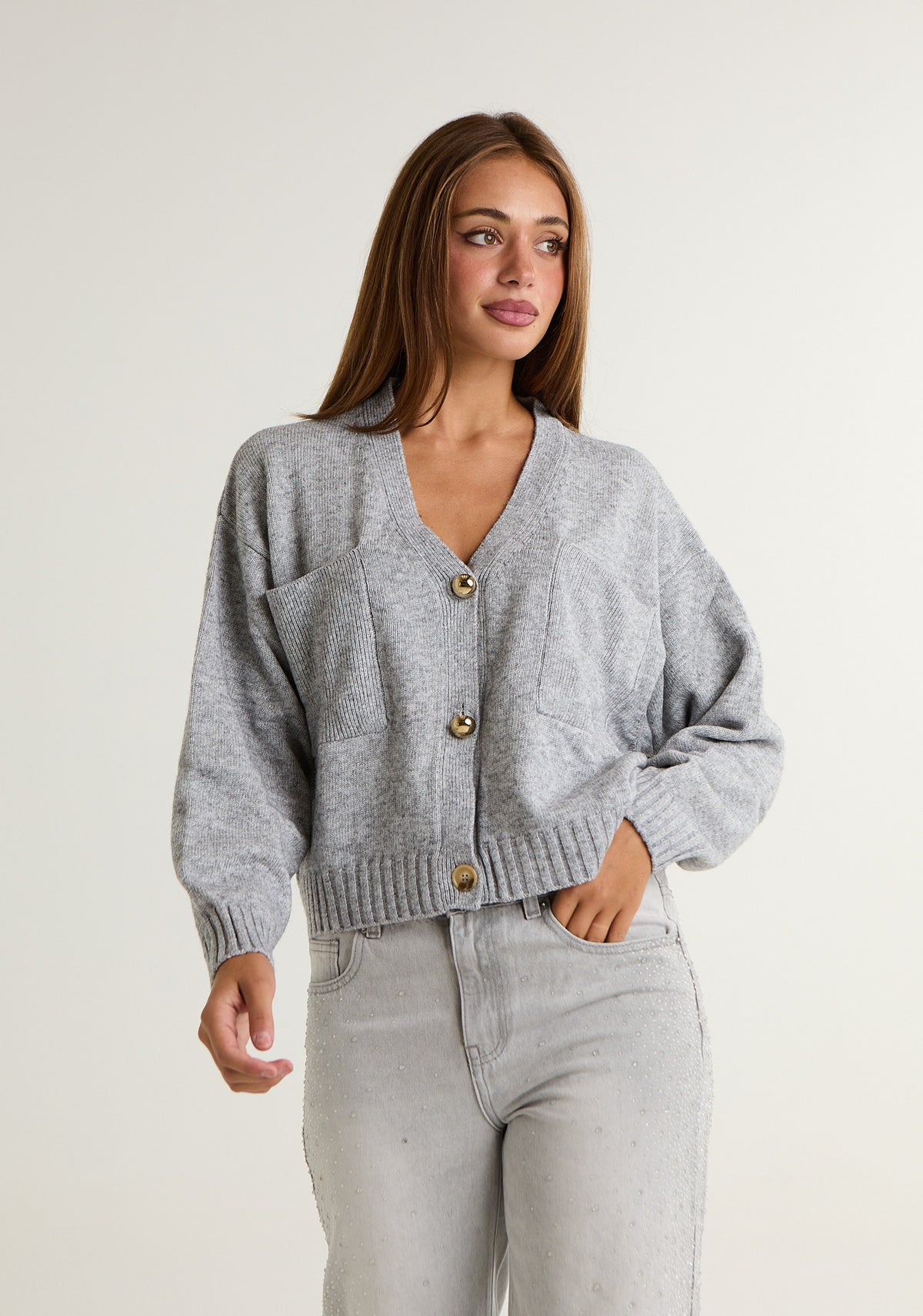 Cardigan in maglia con tasche laterali