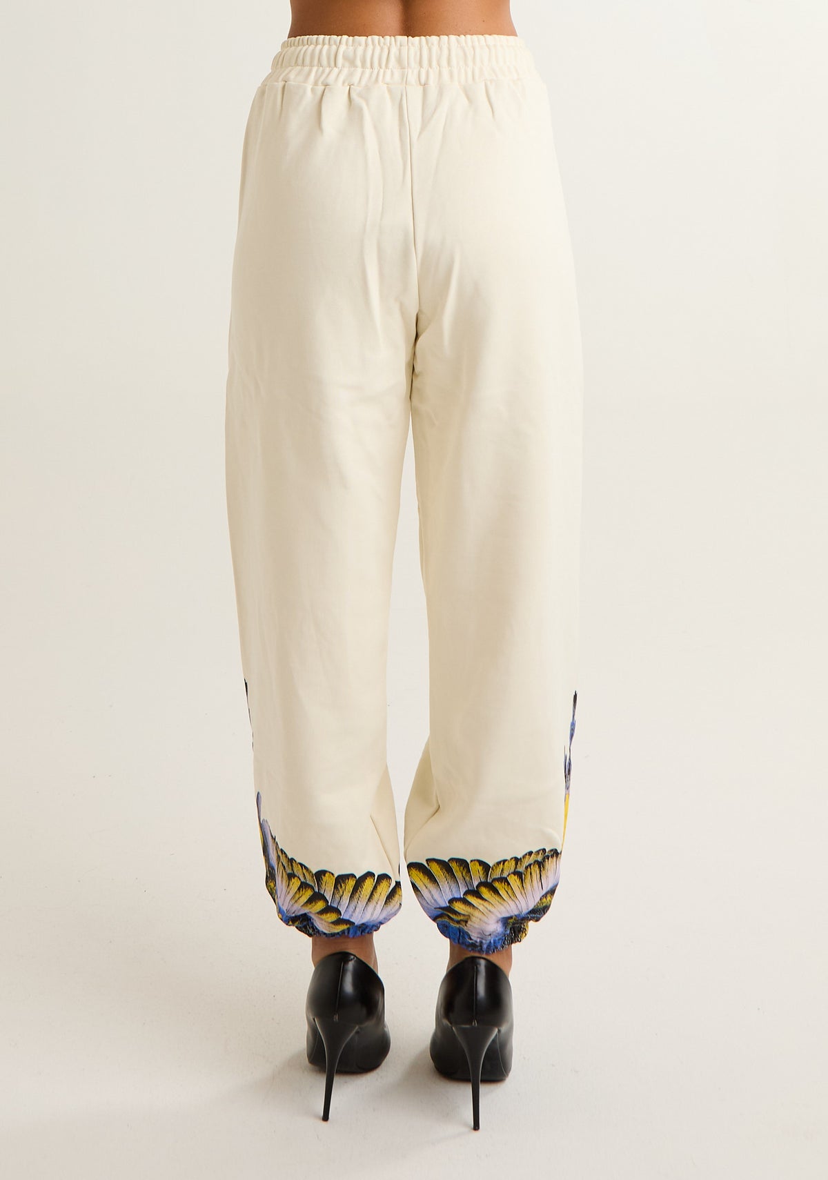 Pantalone tuta con ali colorate