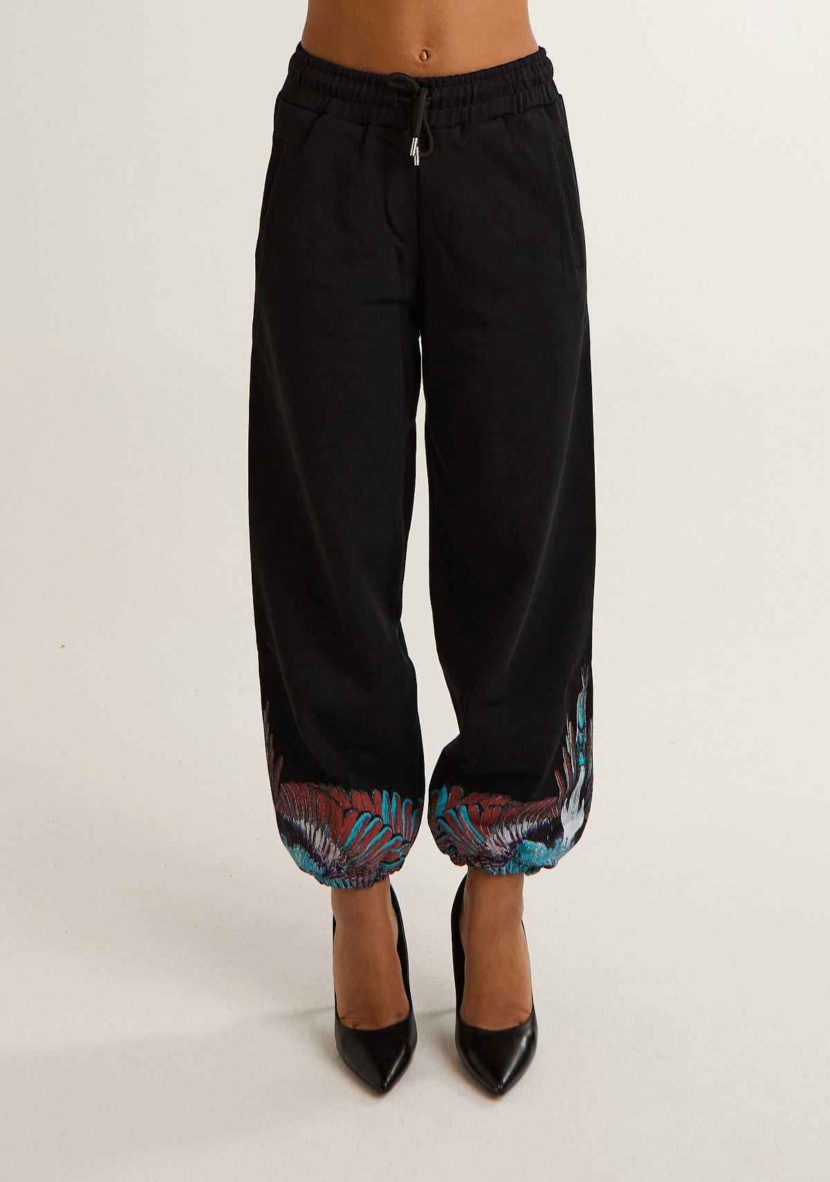 Pantalone tuta con ali colorate