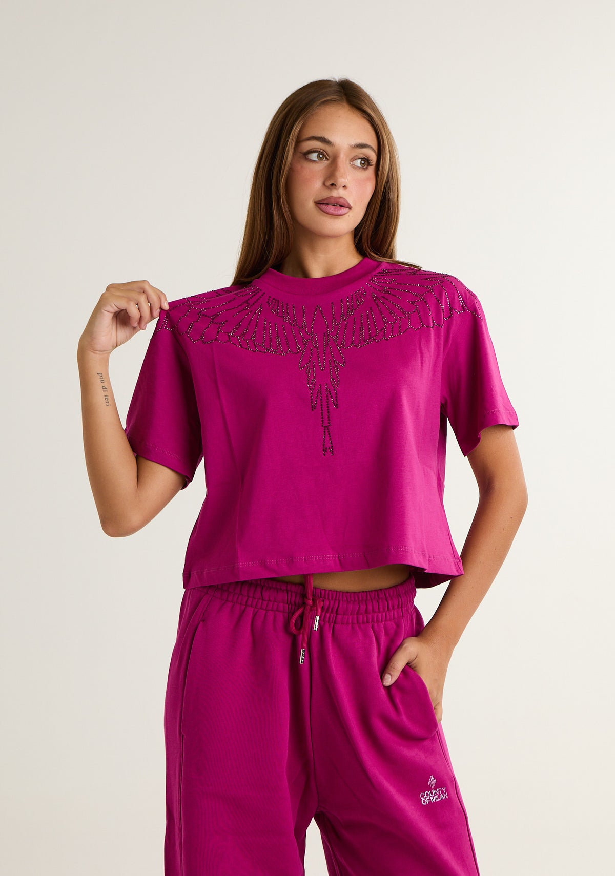 T-shirt con ali preziose