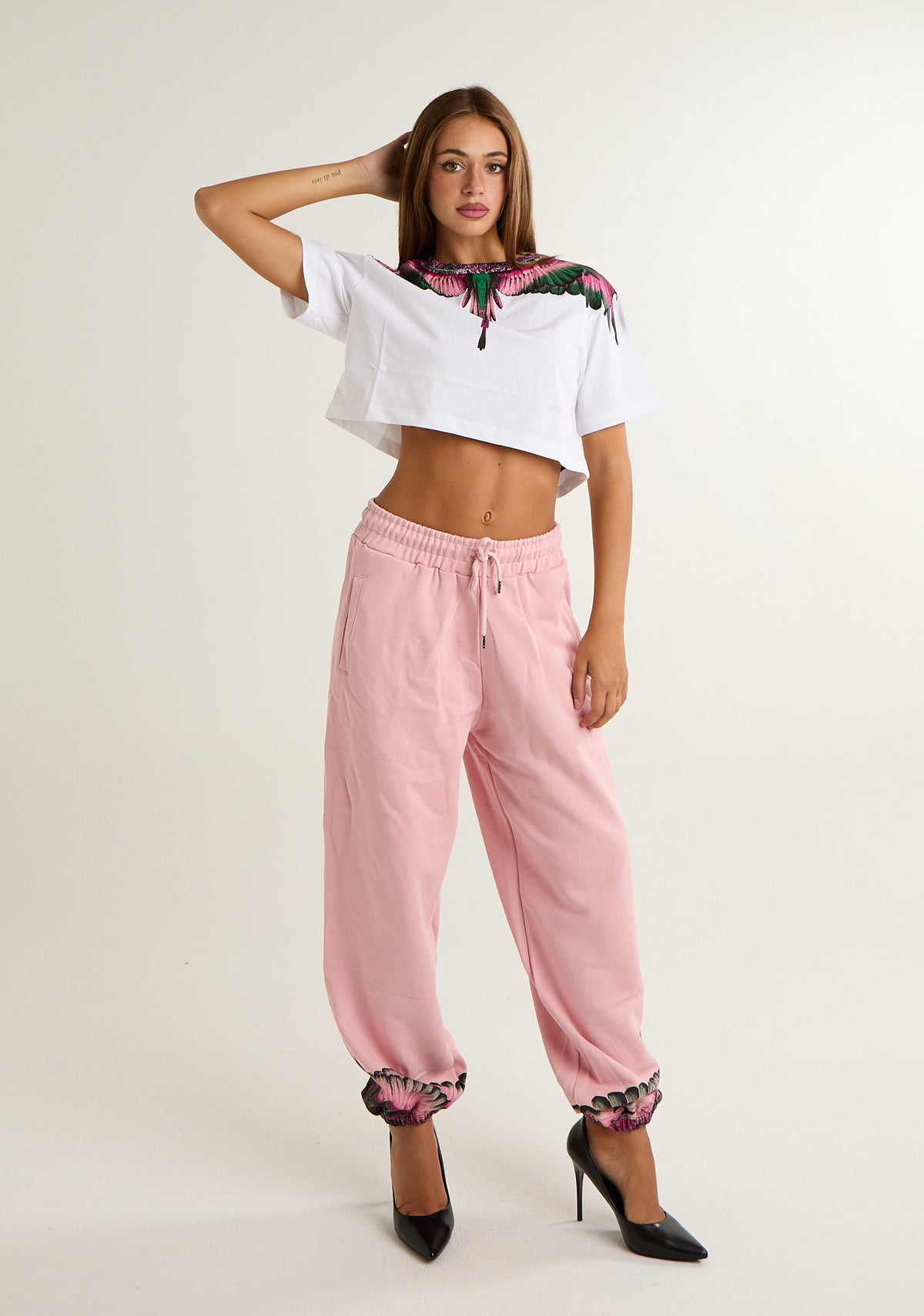 Pantalone tuta con ali colorate