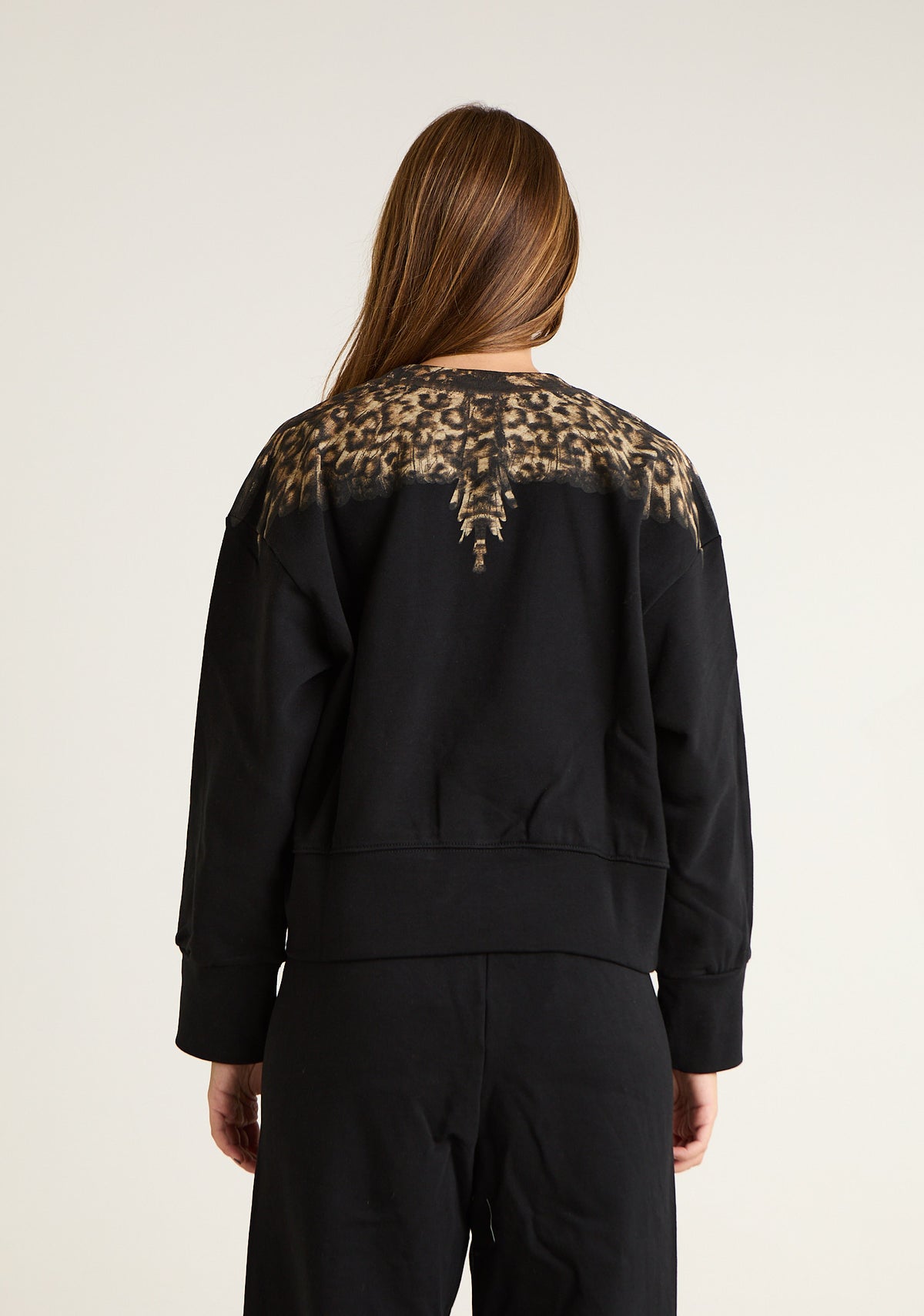 Felpa girocollo con ali animalier