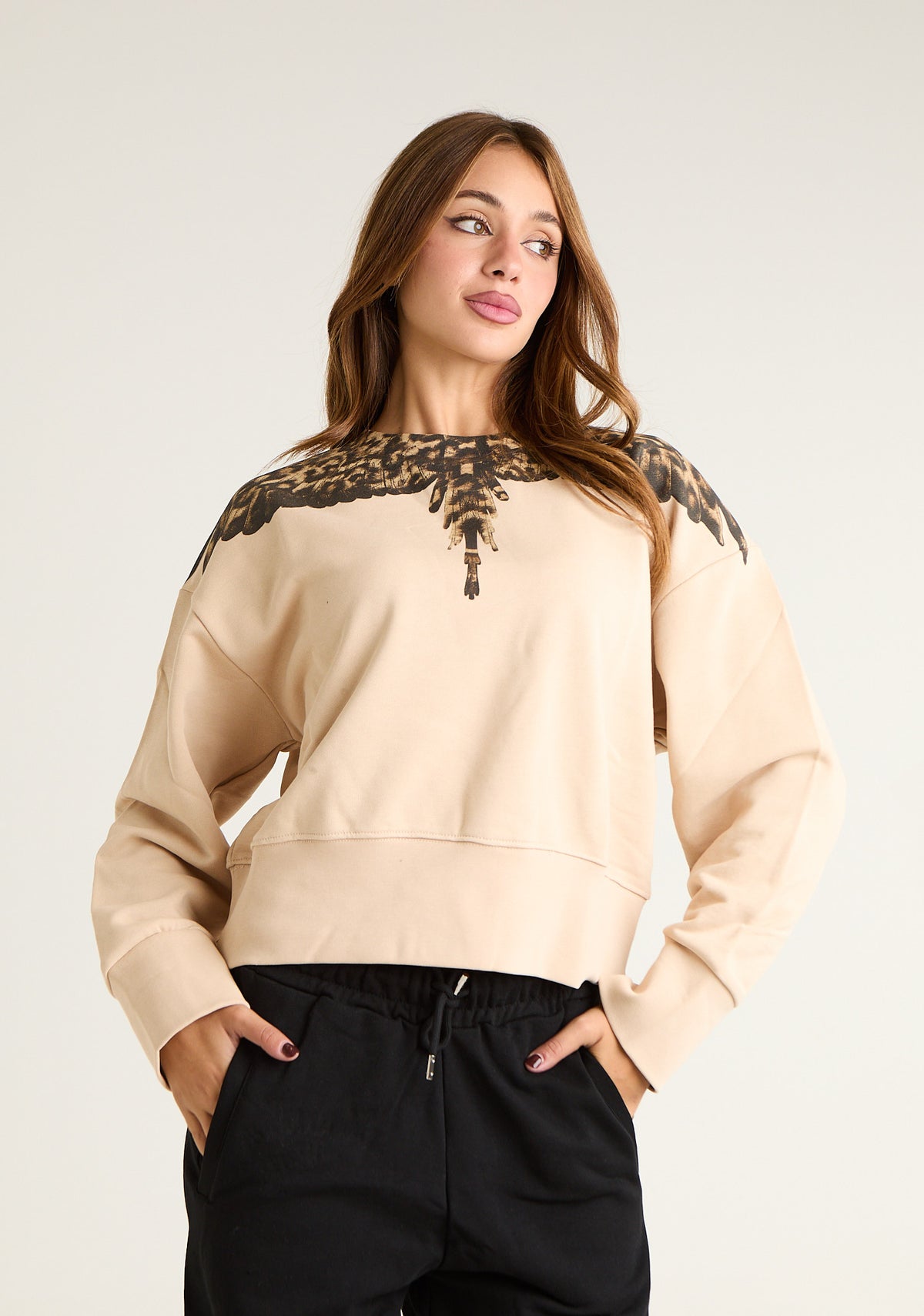 Felpa girocollo con ali animalier