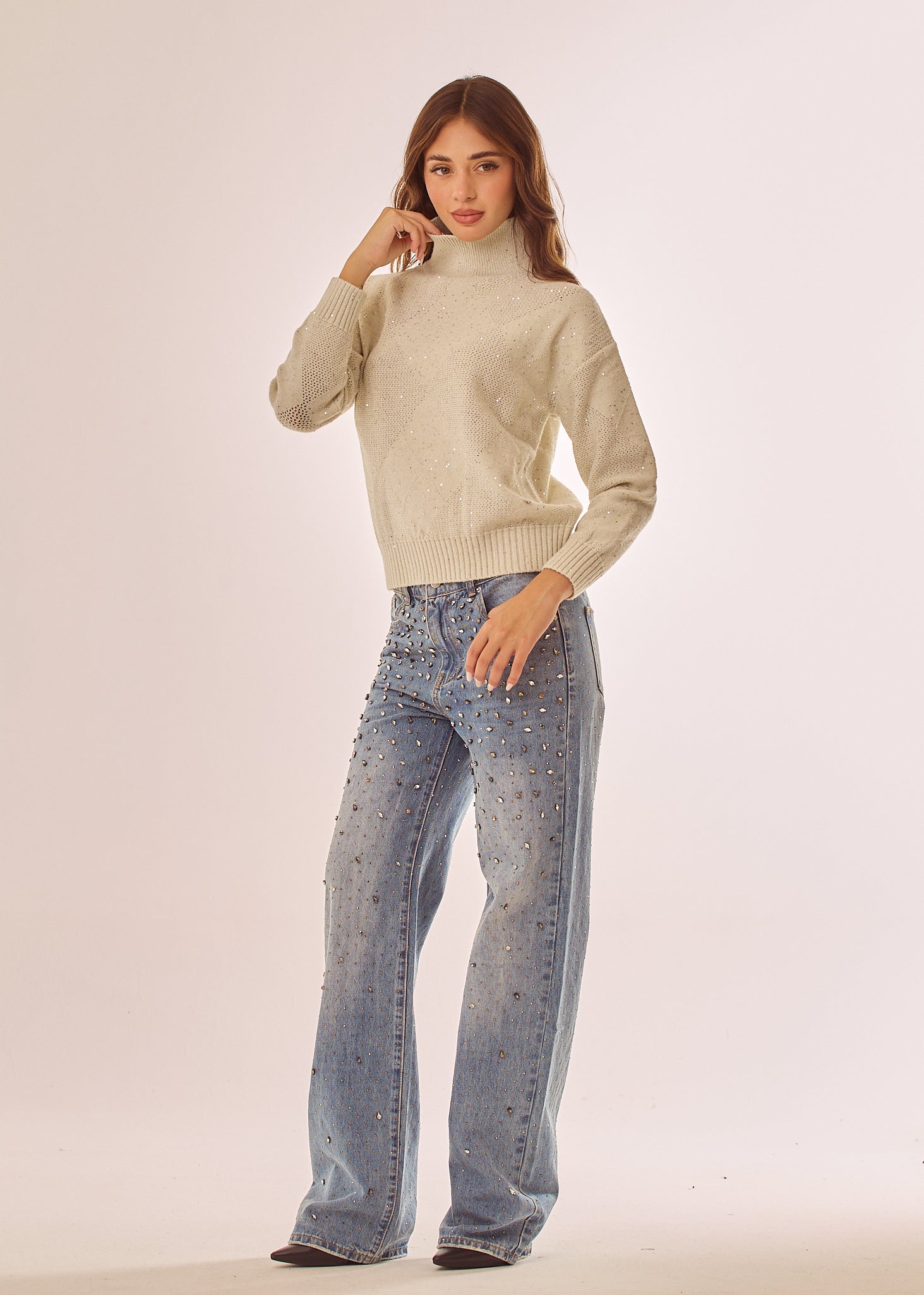 Maglia dolcevita con glitter e paillettes