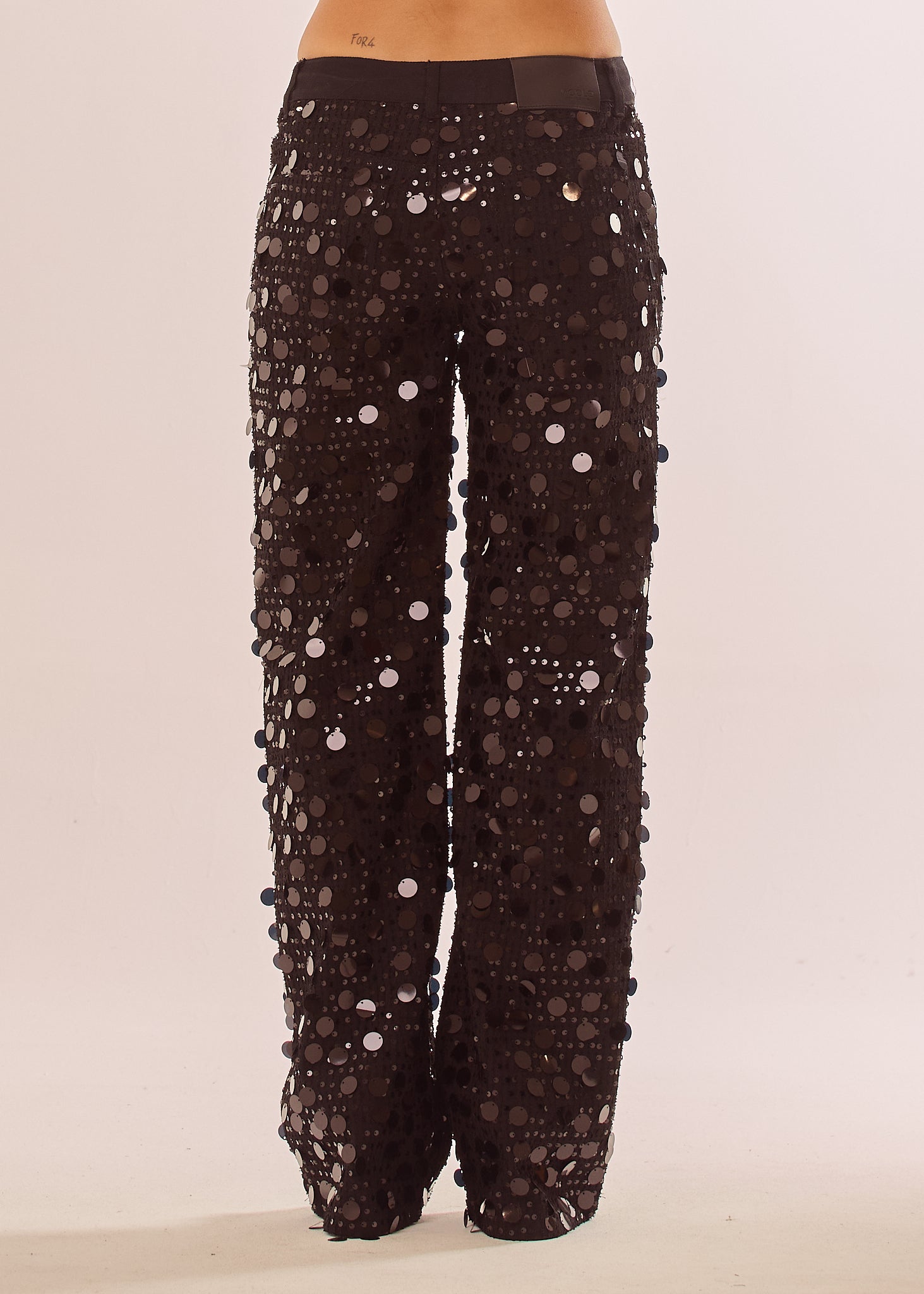 Jeans con paillettes grandi all over