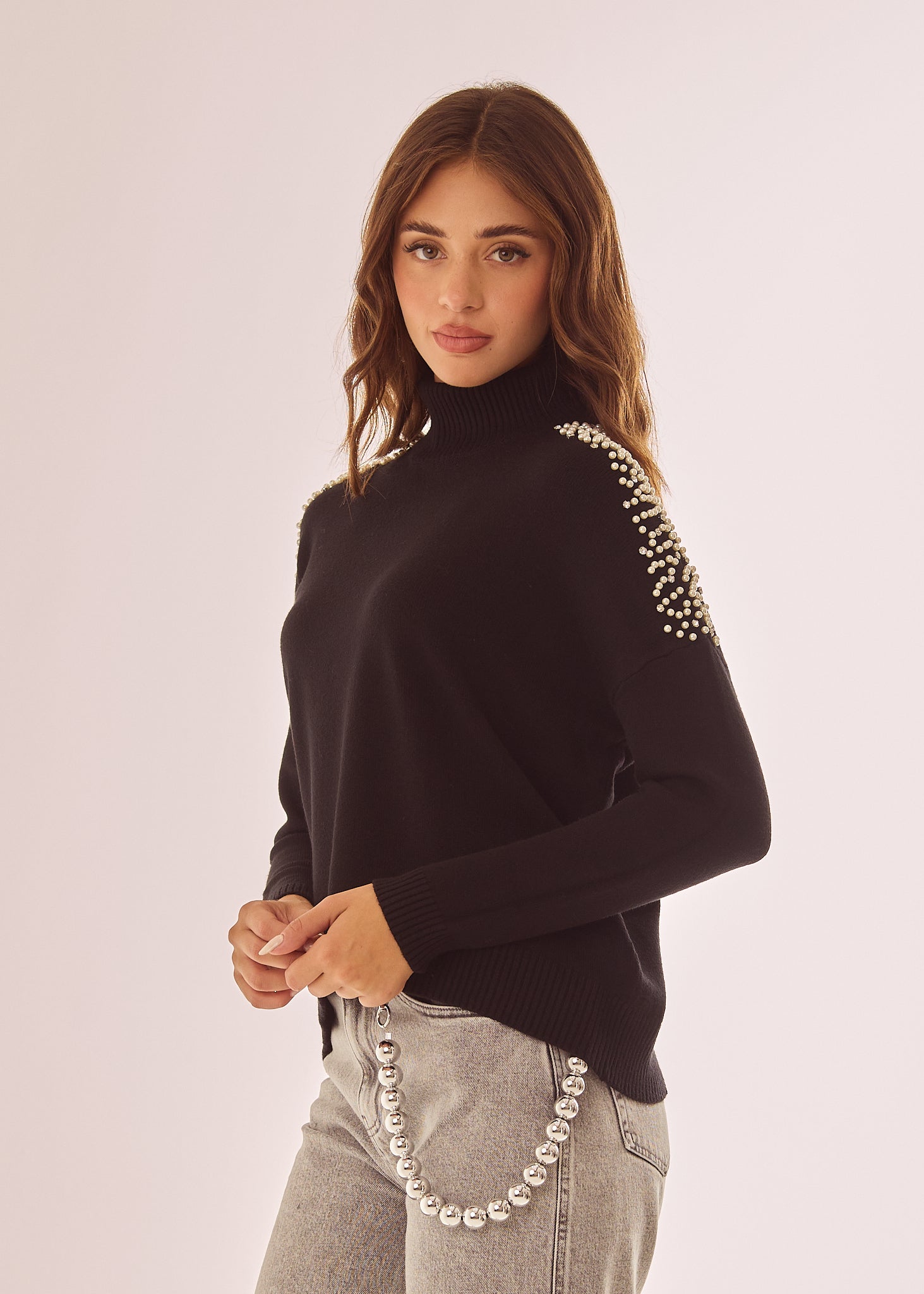 Maglia dolcevita con applicazioni