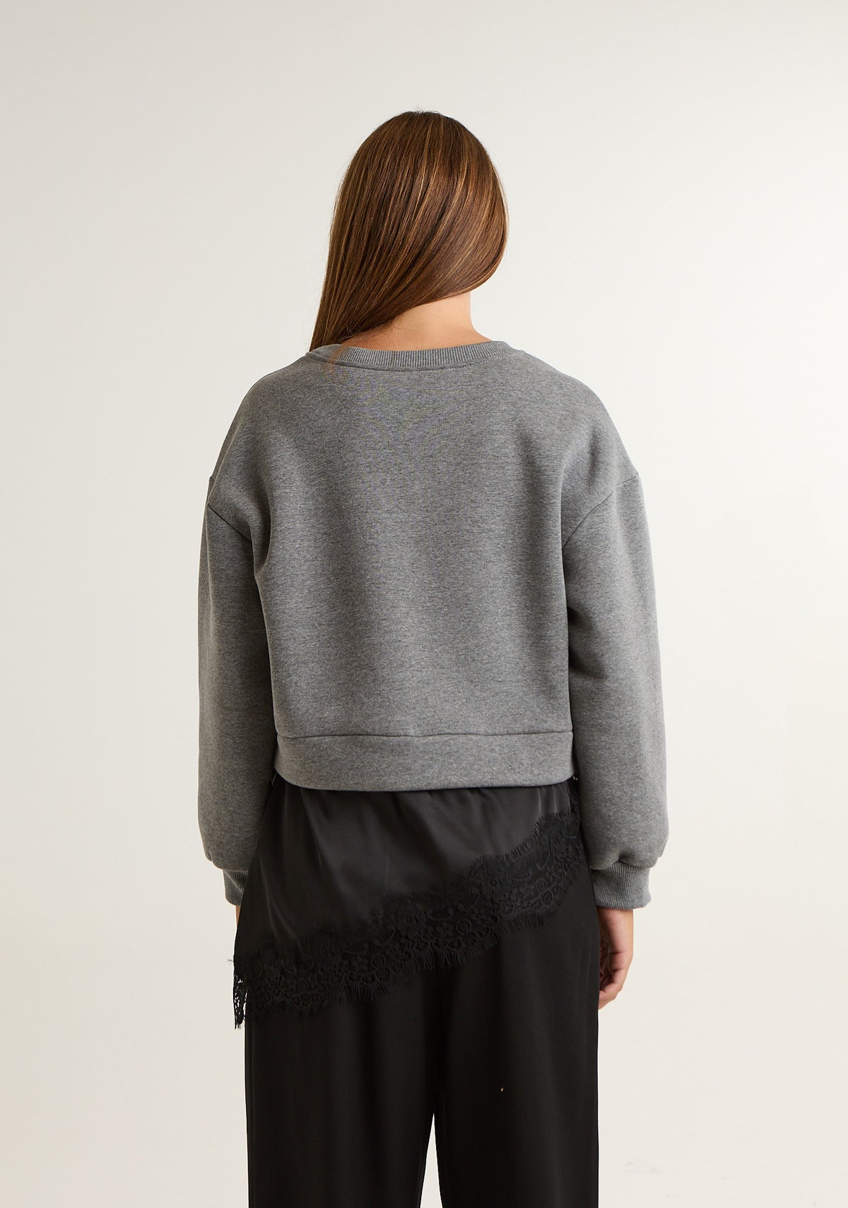 Felpa asimmetrica con pizzo