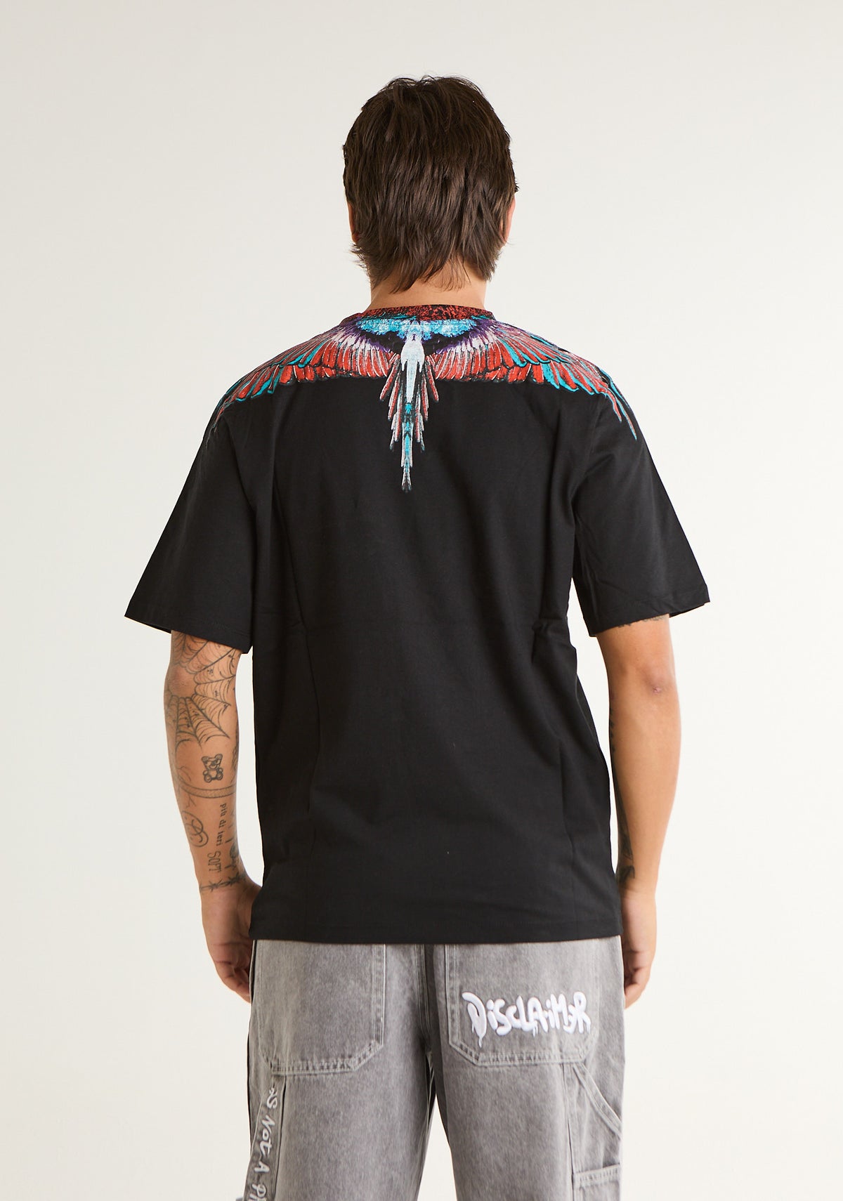 T-shirt con ali colorate