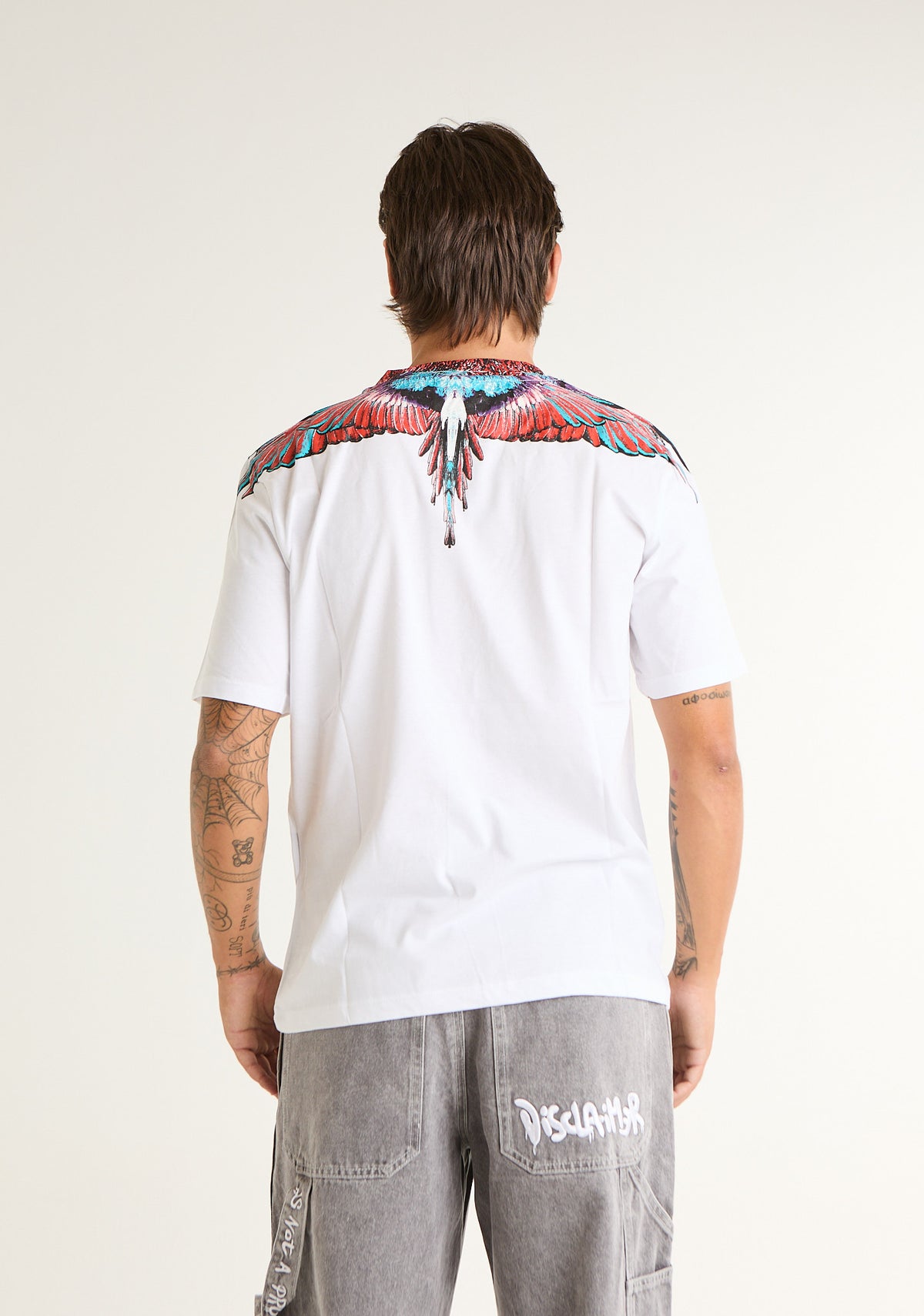 T-shirt con ali colorate