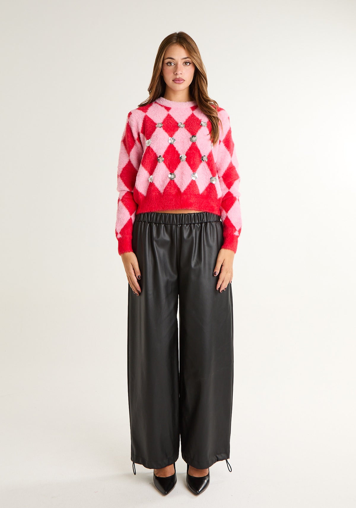 Pullover geometrico con applicazioni