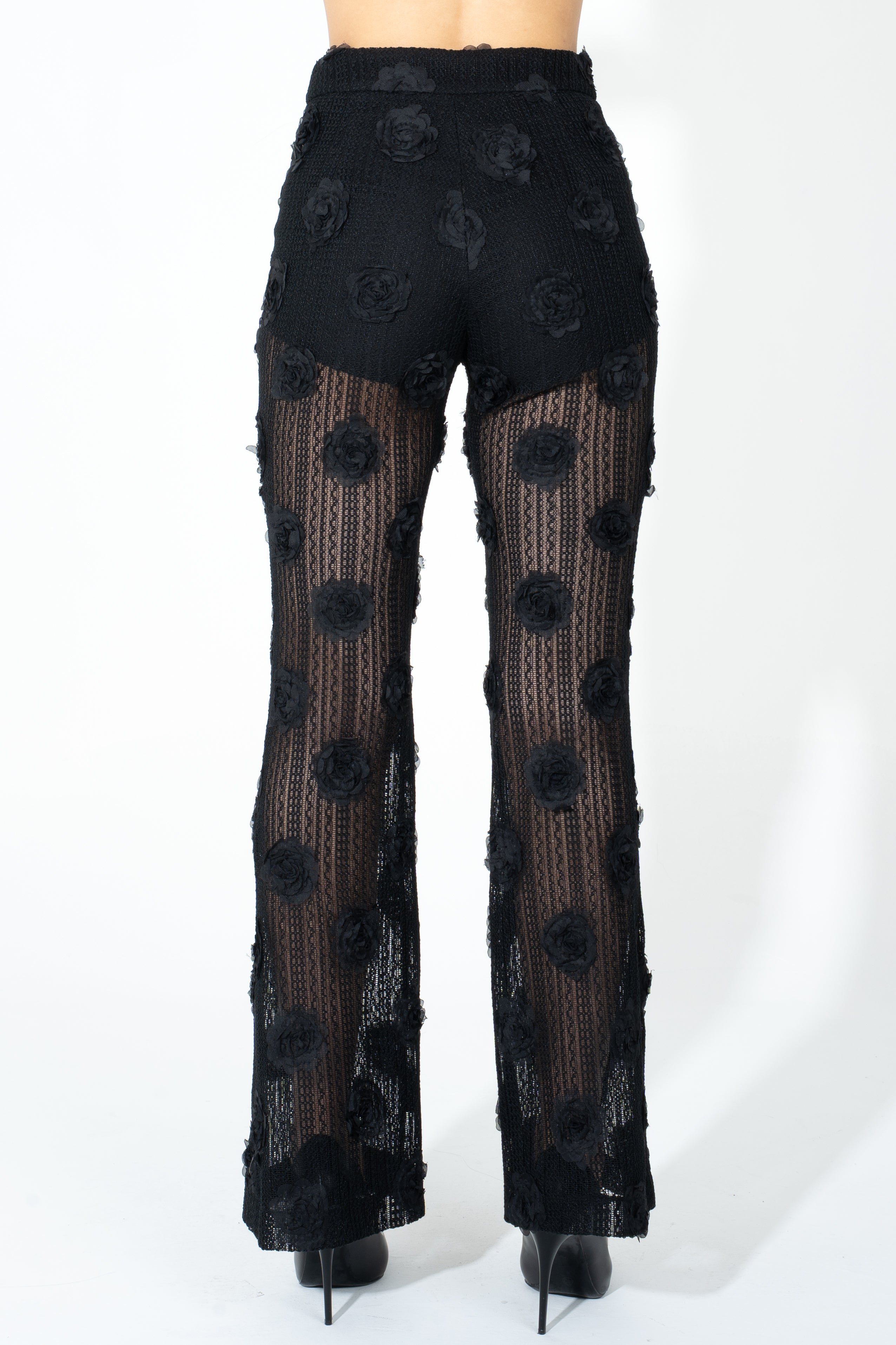 Pantalone in maglia con fiori applicati