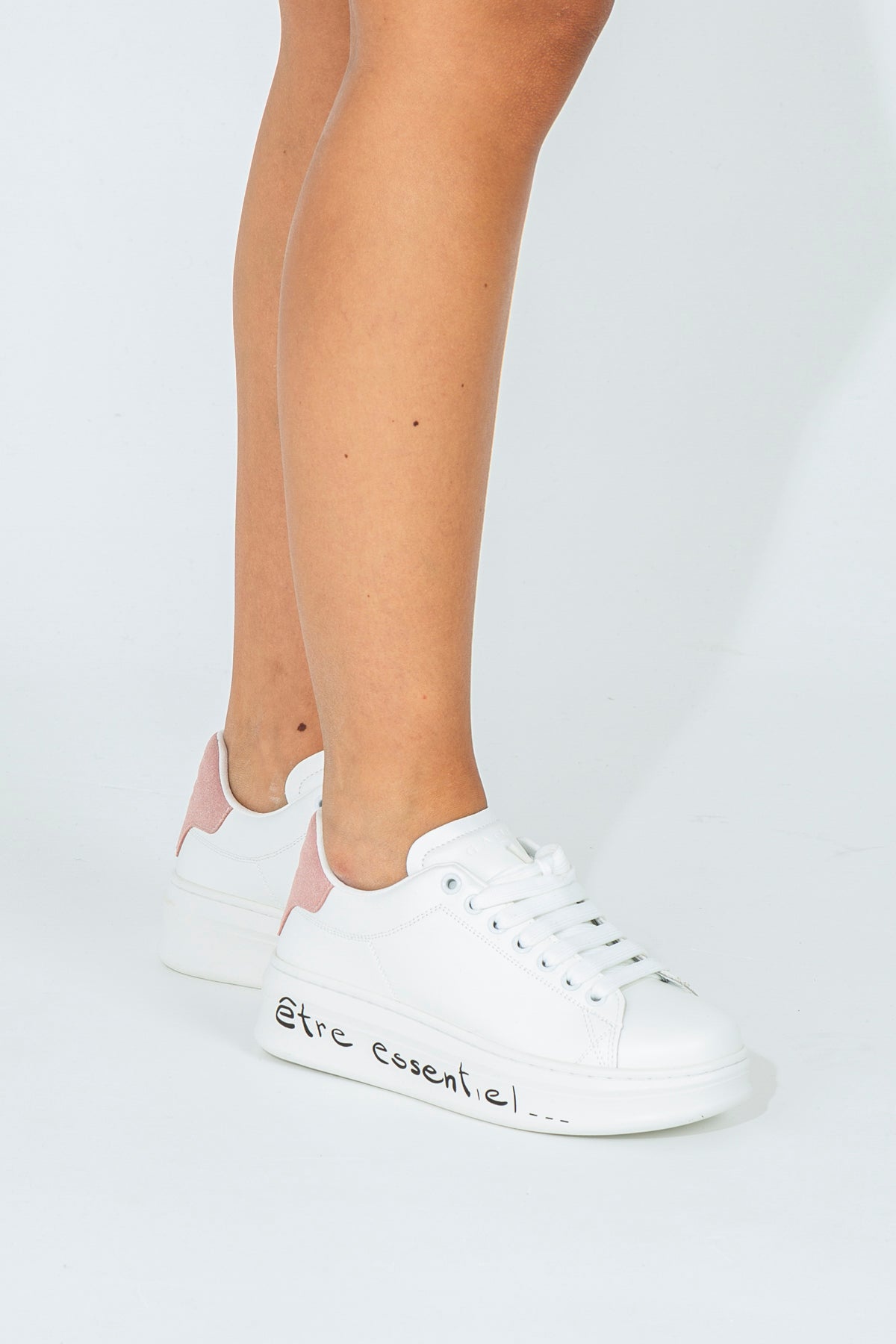 Sneakers with branded heel