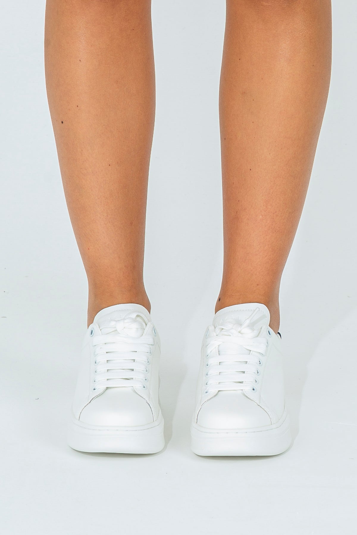 Sneakers with branded heel