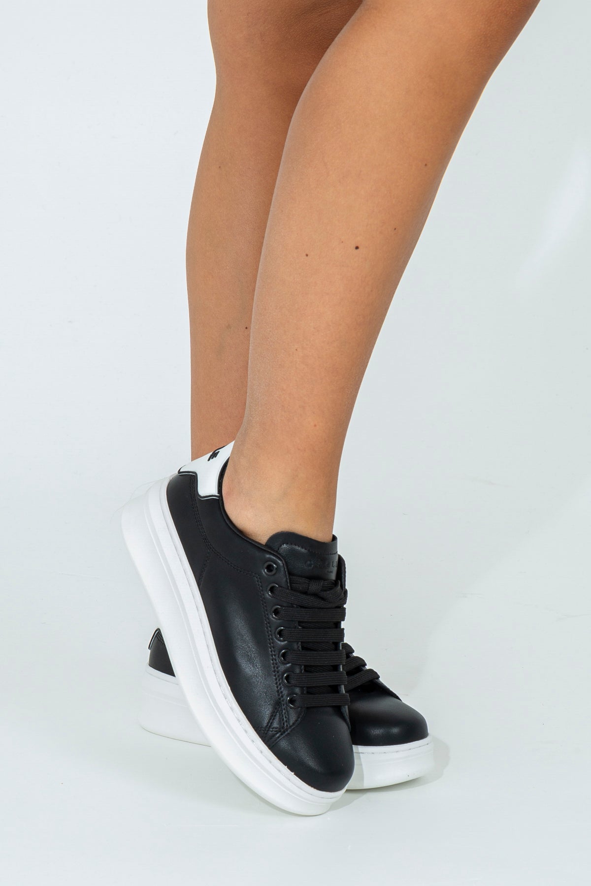 Sneakers with branded heel