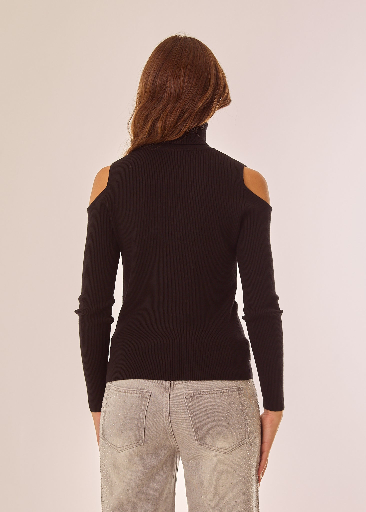 Maglia dolcevita con applicazioni