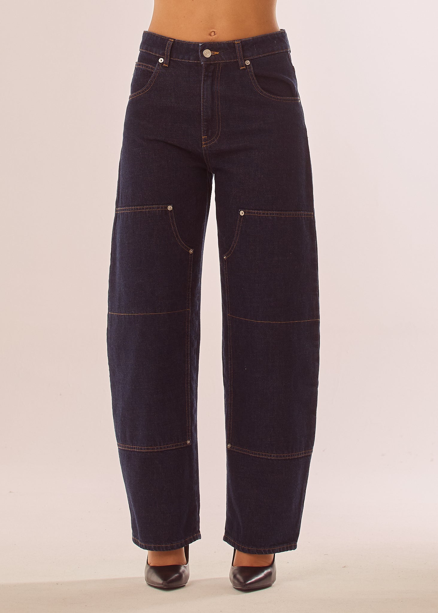 Jeans baggy con impunture a contrasto