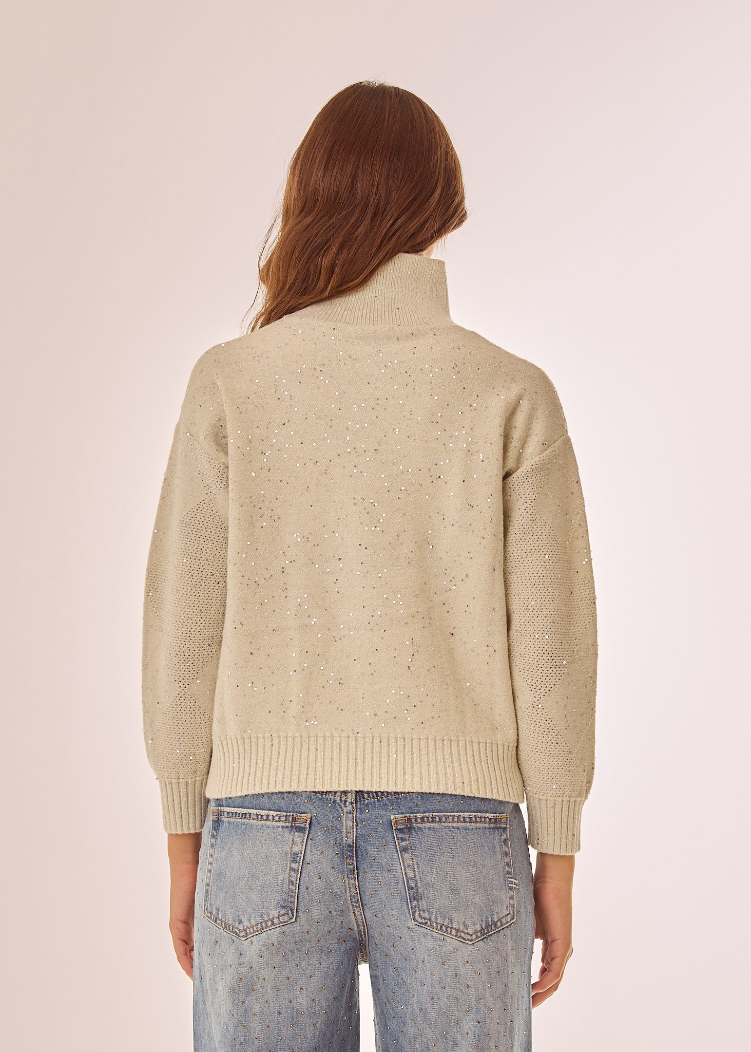 Maglia dolcevita con glitter e paillettes