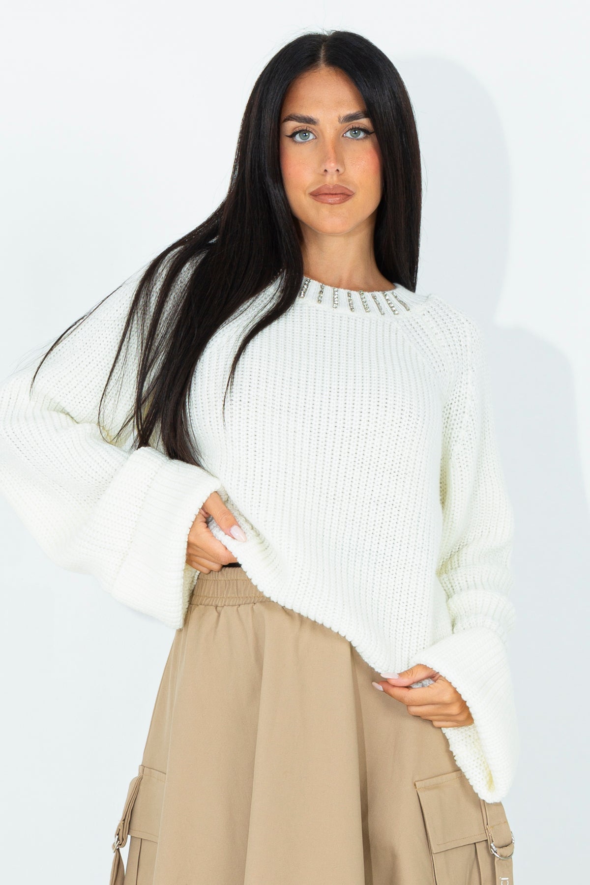 Knitted sweater with appliques on the neckline