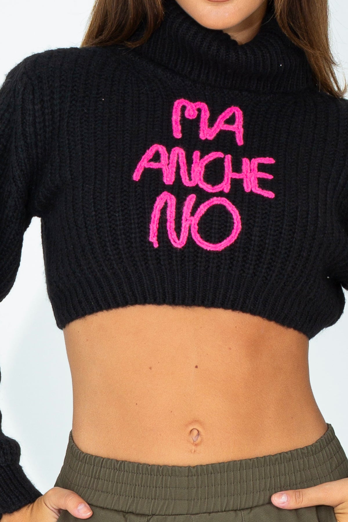 Crop turtleneck sweater with embroidered phrase