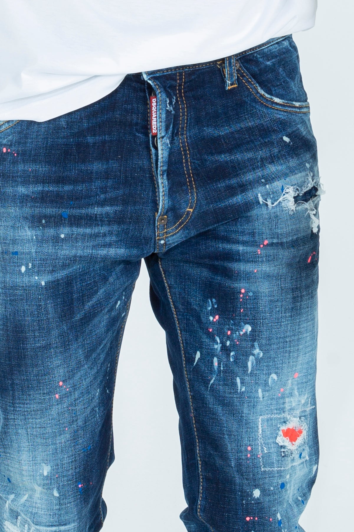 Jeans with rips and color stains